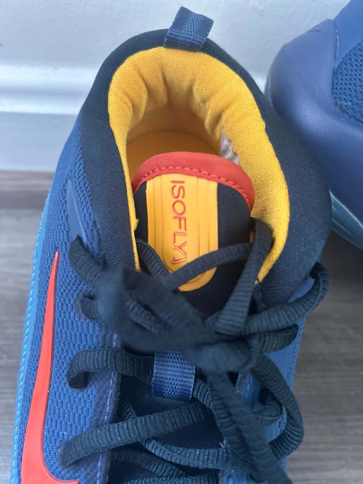 Side view of Nike IsoFly Mystic Navy denim-style sneaker